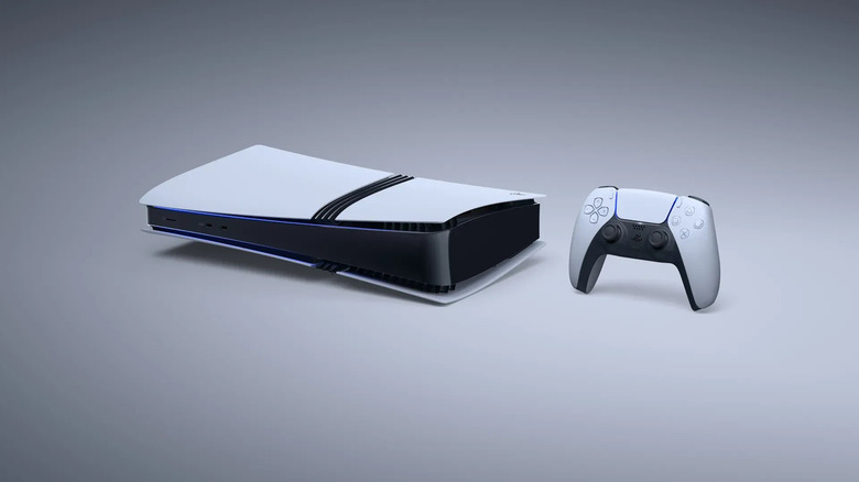 A Sony PlayStation 5 Pro on its side with a DualSense controller.