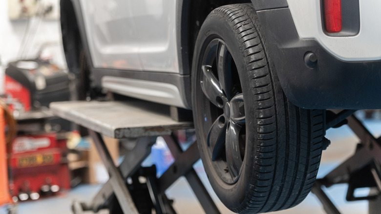 Closeup of rear tire in a workshop