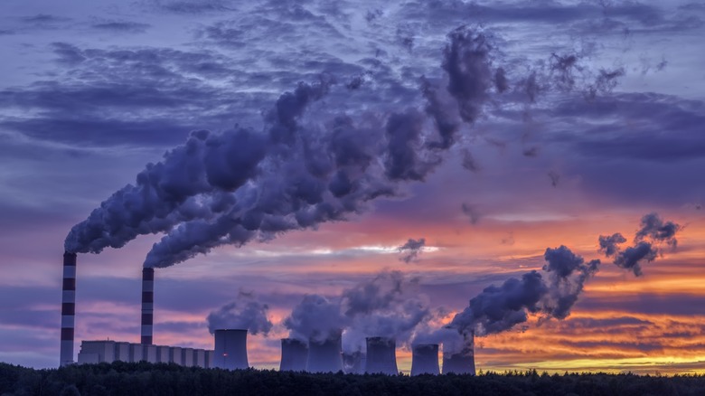 A coal-fired power plant producing electricity for the electric grid.