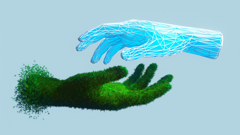 Digital generated image of abstract hand covered by grass touching with digital blue one