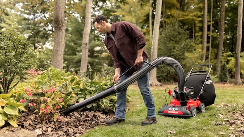 Person using Craftsman Chipper Shredder Vacuum