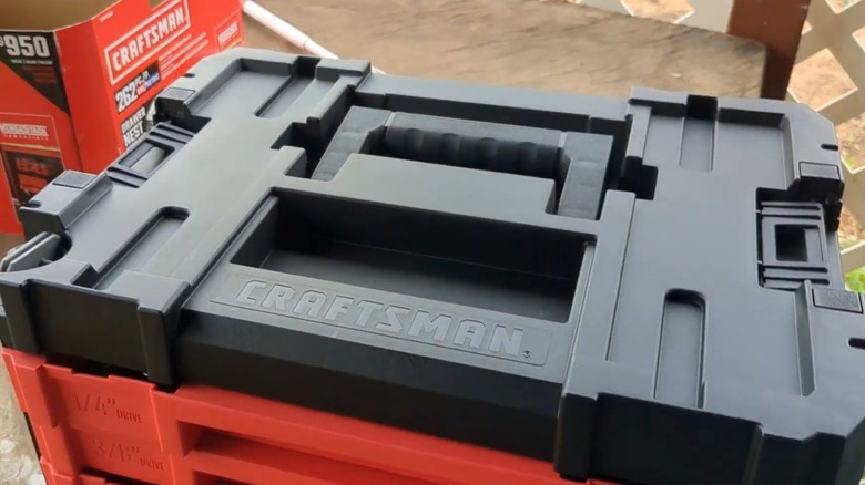 A closed Craftsman VersaStack toolbox outside.