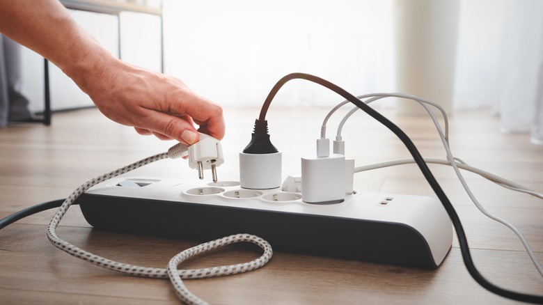 charging devices plugged into power strip