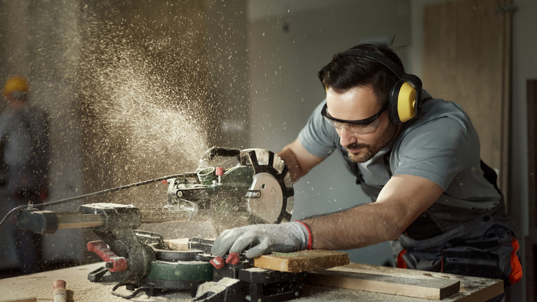 Person using miter saw