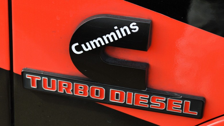 Close-up shot of the Cummins Turbo Diesel emblem on a vehicle