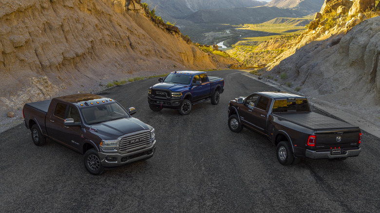 Three Dodge RAM heavy duty trucks for the 2019 model year parked in a desert