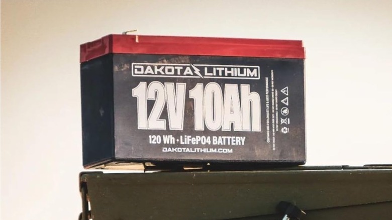 A Dakota battery rests on top of a steel carrying case