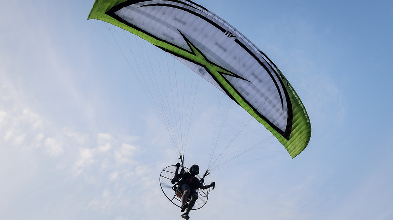 A paramotor pilot in flight.