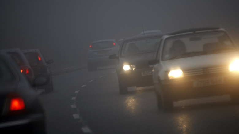 Driving on the highway amidst rain and fog