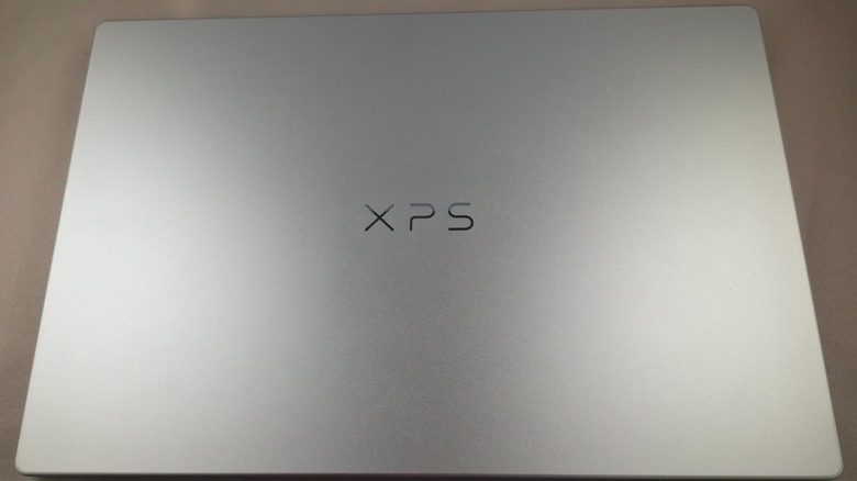 The back of the Dell XPS 13 laptop on a grey background