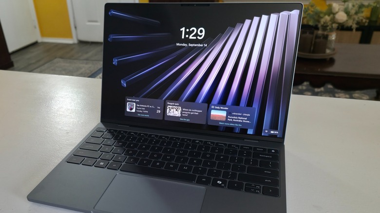 The Dell XPS 13 laptop open showing the lock screen