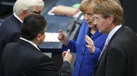 German Chancellor Merkel shakes talks with leader of SPD Gabriel SPD parliamentary floor leader Steinmeier and Federal Chancellery Minister Pofalla prior to constitutional meeting in Berlin