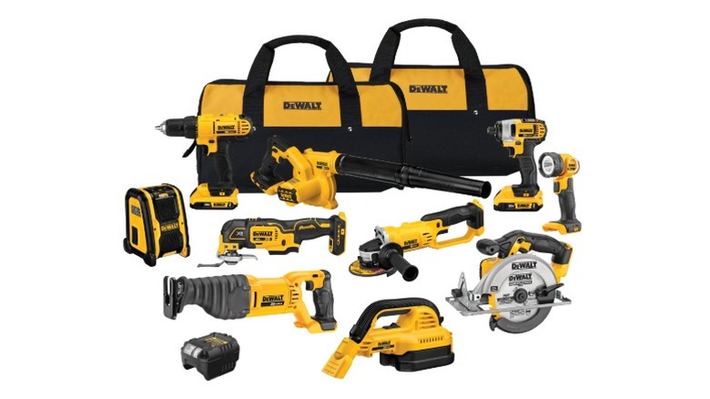 DeWalt 10-Tool Combo Kit with batteries, charger, and bags on whit background