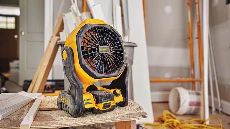 DeWalt 511 fan sitting on table in a job site