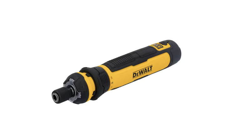 Using a DeWalt cordless screwdriver to work on an electrical switch.