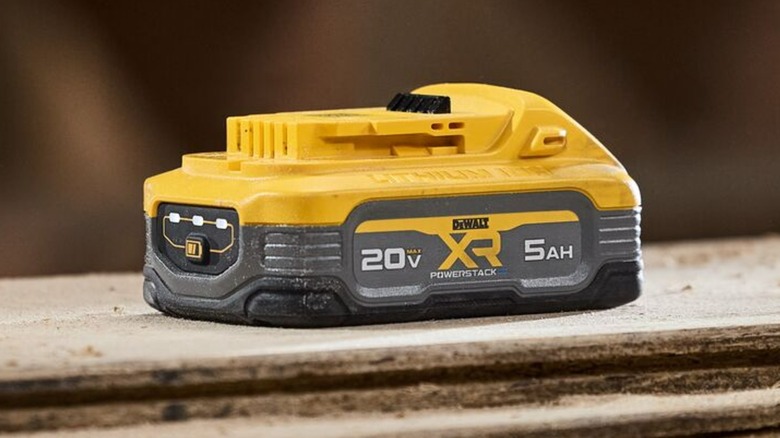 A DeWalt Powerstack 20V battery on wood