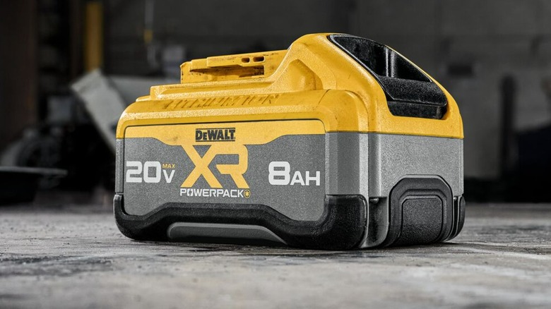 A DeWalt Powerpack battery on concrete