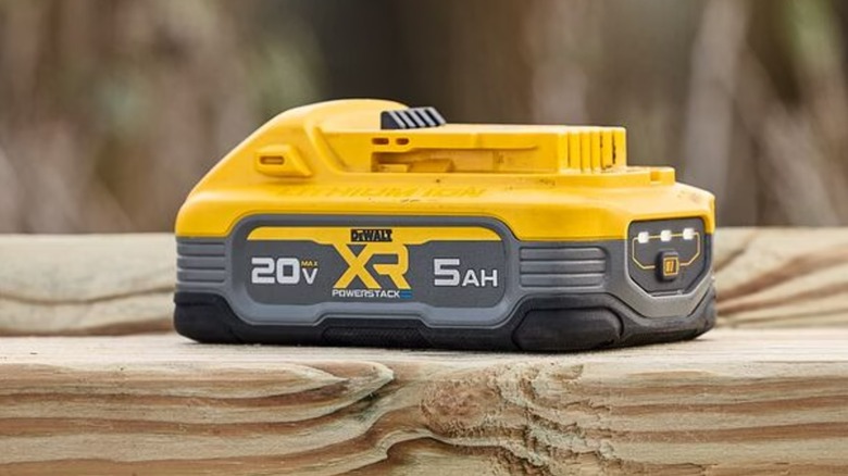A DeWalt Powerstack battery on wood