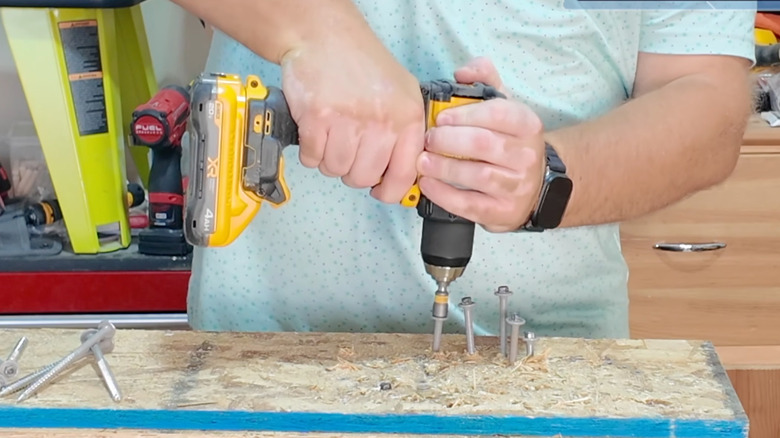 man using PowerPack 4Ah with drills
