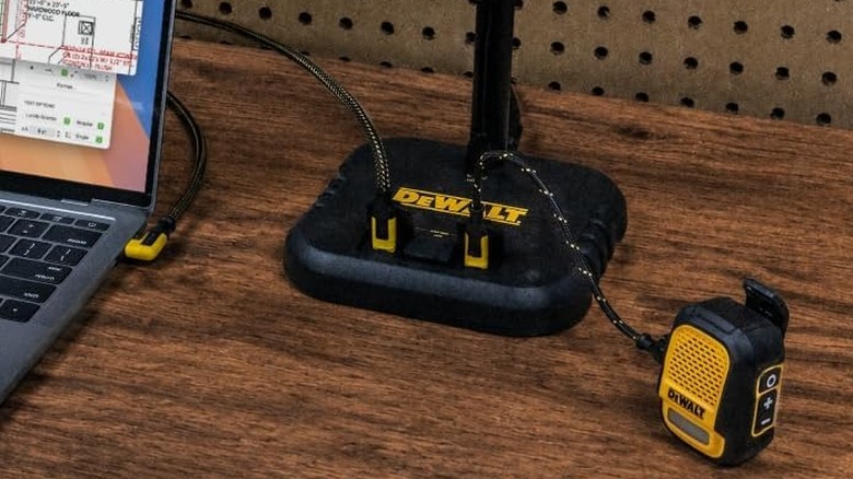 laptop and earphones being charged