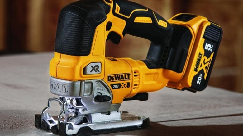 A DeWalt jigsaw on a table.