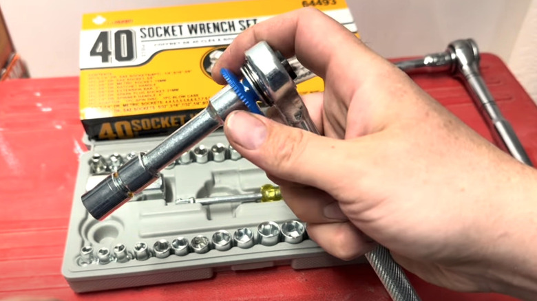 Person using spin disk with a socket wrench