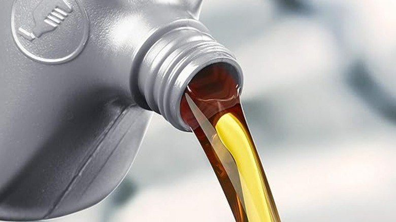 Oil being poured from an Amazon Basics bottle