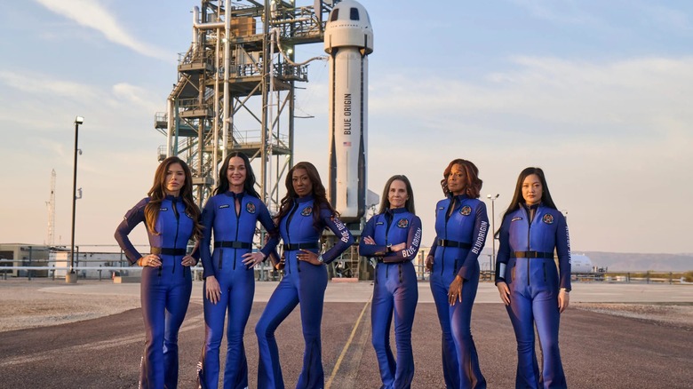 Crew of NS-31 in front of their rocket and craft