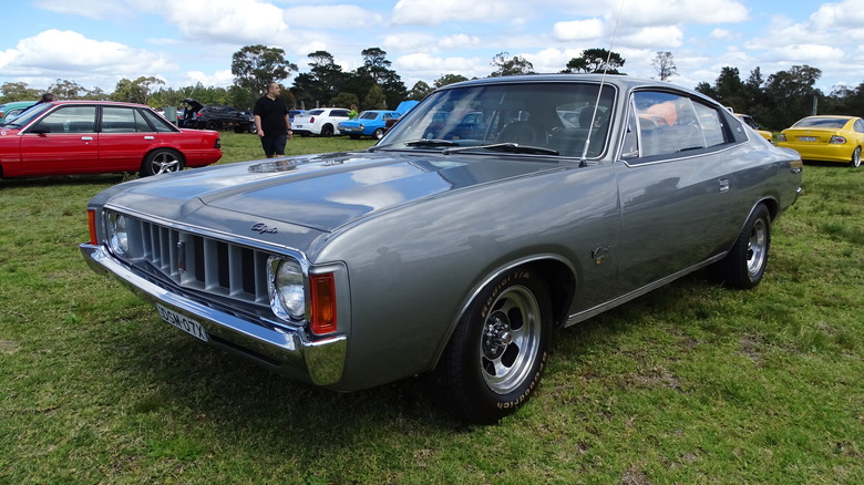 Front 3/4 view of a Chrysler Valiant Charger at an open air car show