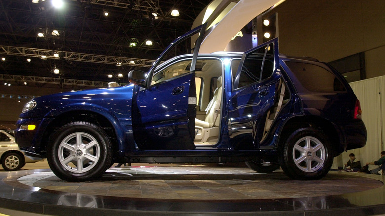 Oldsmobile Bravada SUV at 2001 New York Auto Show, side profile, doors open