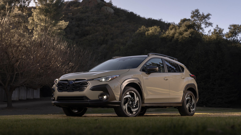 Gray 2026 Subaru Crosstrek Hybrid parked in a field