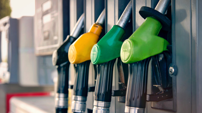 Four fuel station nozzles on pump