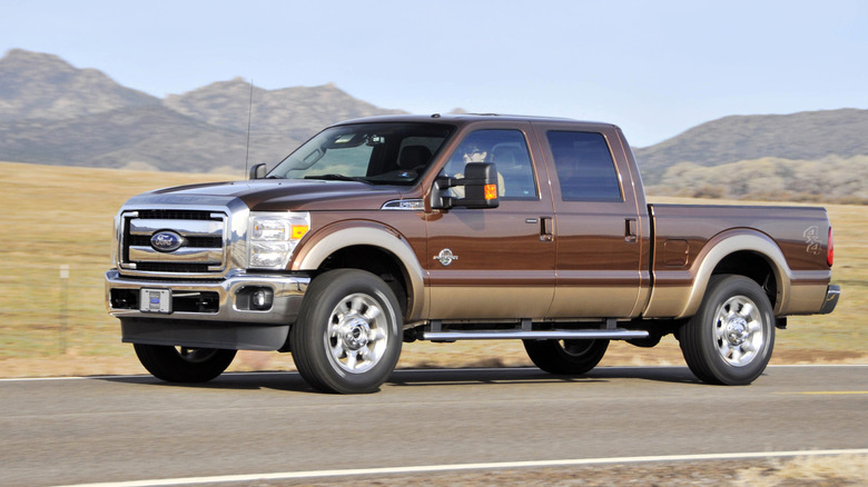 Woman driving diesel pickup truck