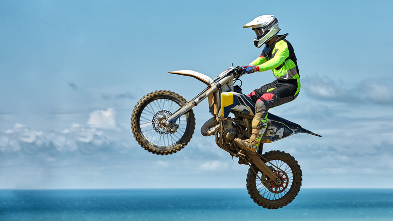 Dirt bike rider near coastline