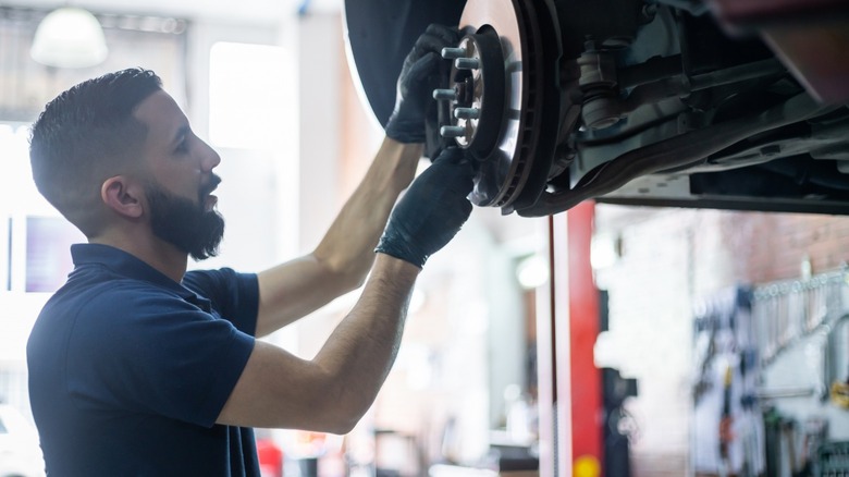 person working on brakes