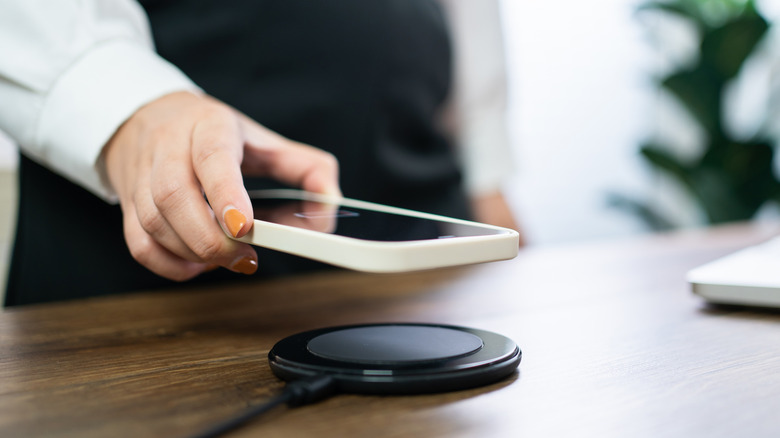 Person using wireless charger