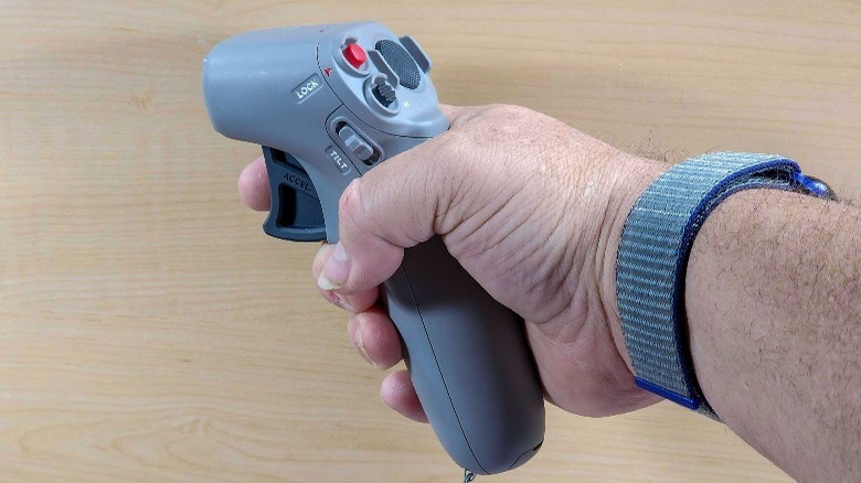 man holding DJI Motion 