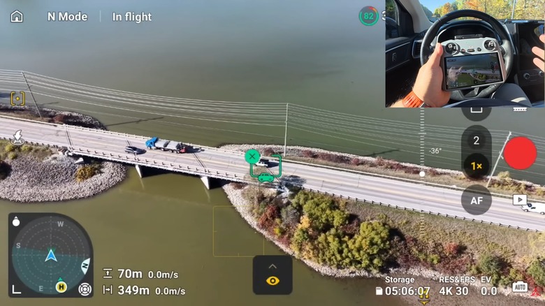 A DJI Mini 5 Pro Active Tracking demonstration with the drone focusing on a moving automobile