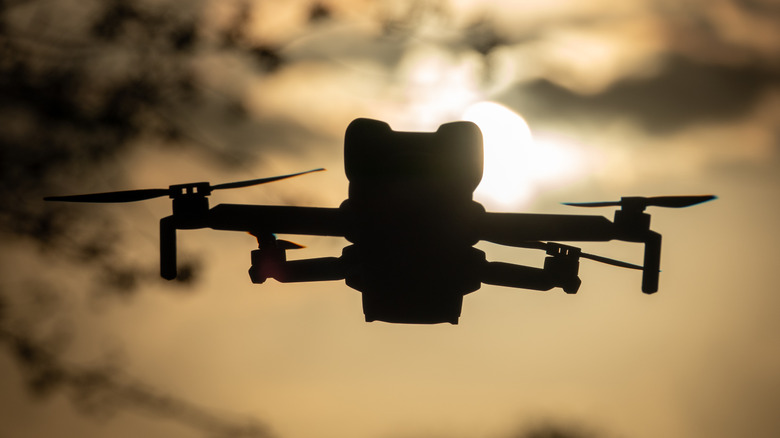 A DJI Mini 5 Pro flies above the ground