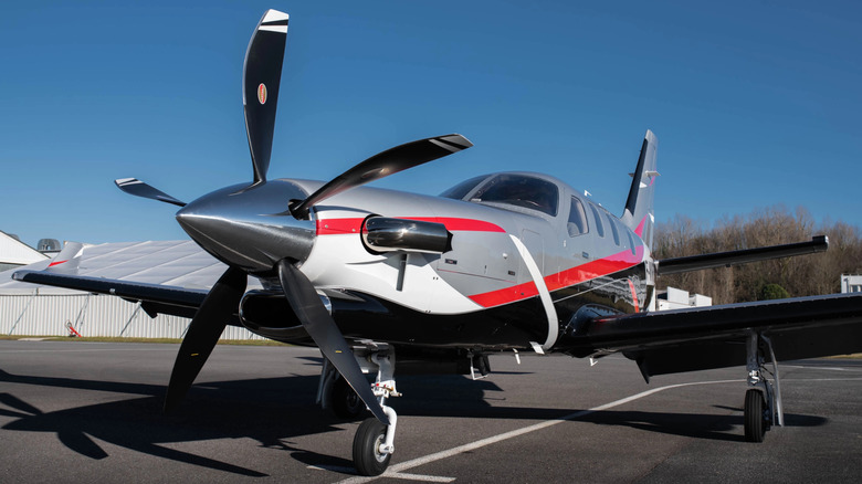Front view of a Daher TBM-960 aircraft parked with flaps extended