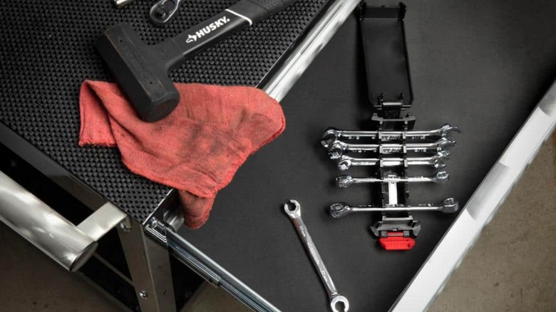 husky hand tools sitting on a tool cart with a dirty red rag