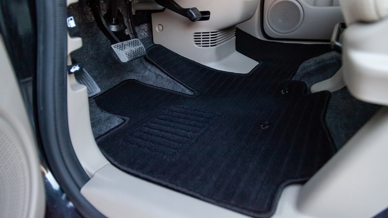 Black floor mats in a cream interior