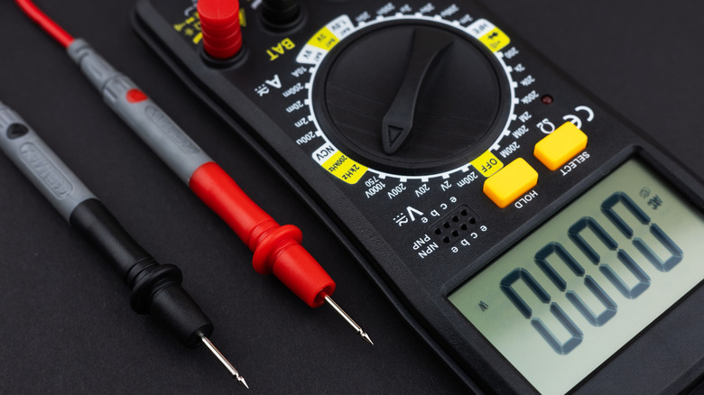A multimeter against a dark backdrop.