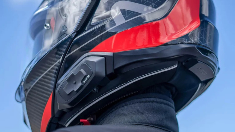 The Cardo HJC 4X featured on a helmet worn by motorcyclist