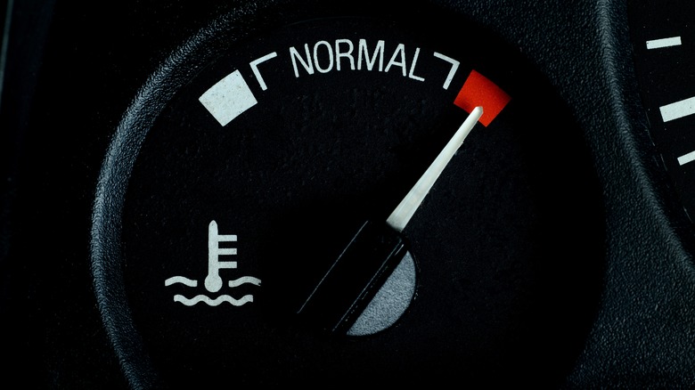 Car temperature gauge with the indicator needle on hot.