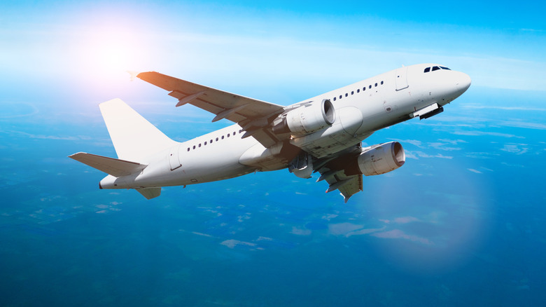 A white commercial airplane in flight
