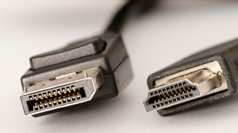 A DisplayPort cable and a HDMI cable next to each other