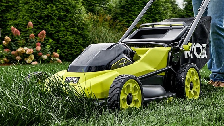 a person using a Ryobi 40V HP 20-inch self-propelled mower to cut grass