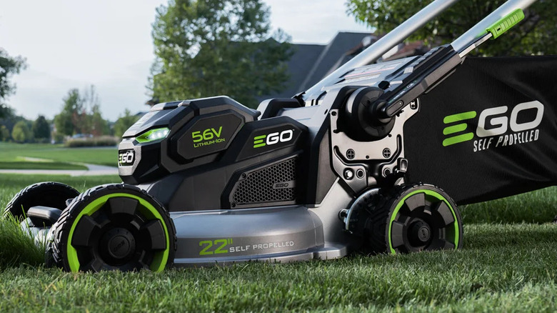 close-up of an Ego Power Plus 22-inch self-propelled motor cutting a suburban front lawn