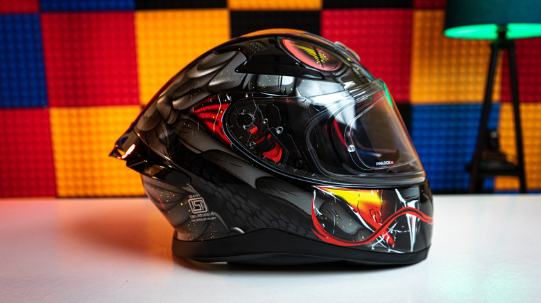 A helmet with a spoiler on the upper rear